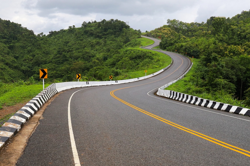 curvy mountain road with guardrails