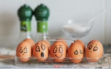 Five painted eggs expressing different emotions.